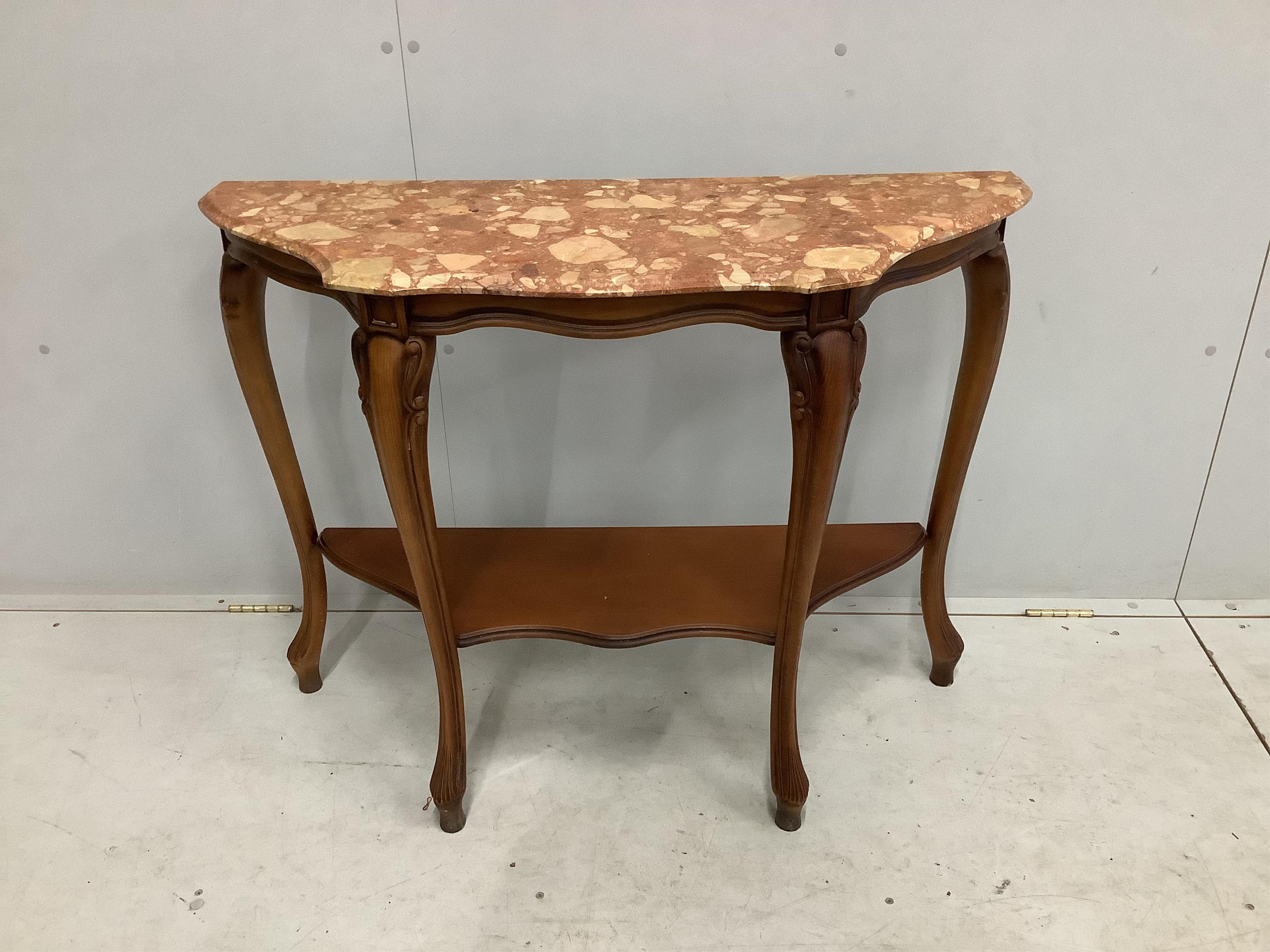 A Louis XVI style walnut serpentine marble topped two tier console table, width 100cm, depth 36cm, height 78cm. Condition - good